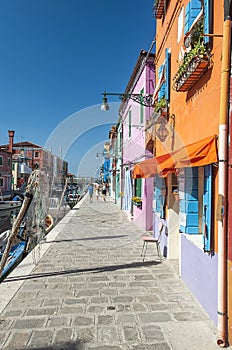 Colorful houses and canal on Burano island, near Venice, Italy.