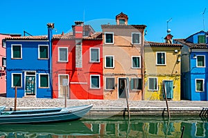 Colorful houses in a canal street houses of Burano island, Venice, Italy