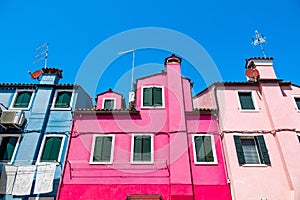Colorful houses in a canal street houses of Burano island, Venice, Italy