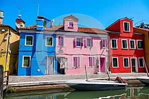 Colorful houses in a canal street houses of Burano island, Venice, Italy