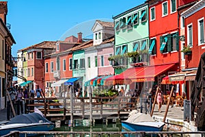 Colorful houses in a canal street houses of Burano island, Venice, Italy