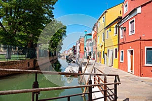 Colorful houses in a canal street houses of Burano island, Venice, Italy