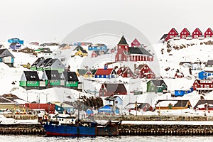 Colorful houses and church on the hill, Sisimiut town view from