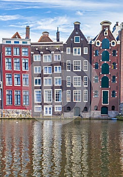 Colorful houses at the Damrak in Amsterdam