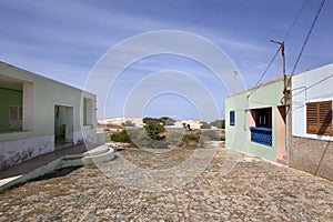 Colorful houses at the end of a paved street in Cape Verde