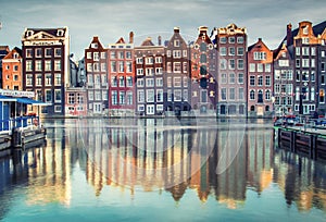 Colorful houses in Amsterdam, Netherlands at sunset