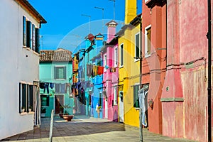 Colorful houses near canal on Burano island, Venice, Italy
