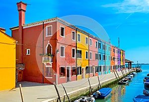 Colorful houses near canal on Burano island, Venice, Italy