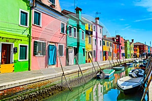 Colorful houses near canal on Burano island, Venice, Italy