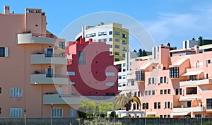 Walking the footpath Passeio do Tejo along Tagus river in Lisbon at the Expo park - with colorful houses photo