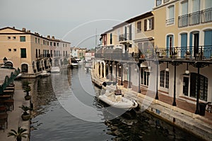 Colorful houses in Port Grimaud, village on Mediterranean sea with yacht harbour, Provence, France