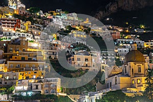 Colorful houses of Positano along Amalfi coast at night, Italy. Night landscape