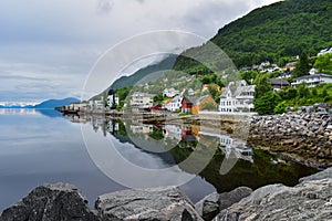 Colorful houses reflecting in water, Norway landscape
