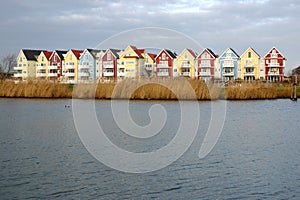 Colorful houses beside a river 1