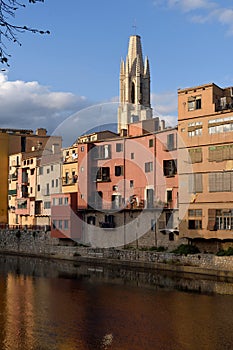 Colorful houses on the river Onyar and Cathedral,