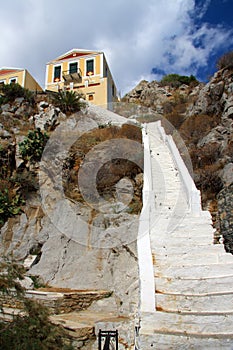 Colorful houses on rocks.Island Symi