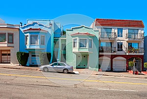 Colorful houses on sloping street in San Francisco.