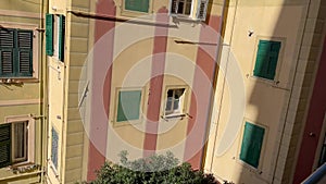 Colorful houses and staircases of fishing town Camogli Italy. Village in rocks. Seaside cove of Ligurian Sea.
