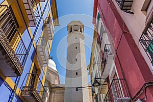 Colorful houses and tower of the Sant Maure church in Alcoy photo