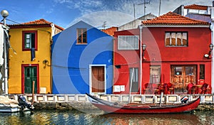 Colorful houses and typical boats in Aveiro photo