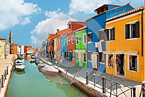 Colorful houses by the water canal at the island Burano near venice, Italy