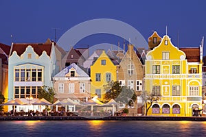 Colorful houses of Willemstad, CuraÃÂ§ao at night photo