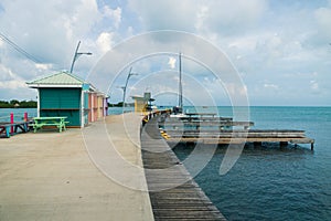 Colorful huts at the boat dock of at the harbor of Placencia, Belize