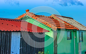 Colorful huts of fishermen against clear sky