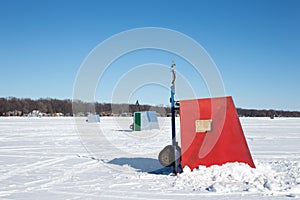 Colorful Ice Shanties on a Frozen Lake photo