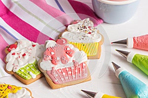 Colorful icing cookies in cupcake shape