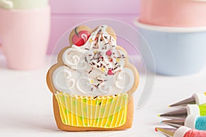 Colorful icing cookies in cupcake shape