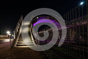 Colorful illuminated walkway inHarlingen with strap and metal si