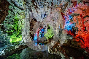 Colorful illumination in Dau Go cave in Halong Bay, Vietnam