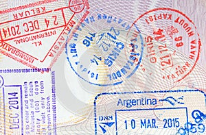 Colorful immigration arrival stamps on passport