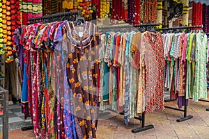 Colorful Indian costumes selling in front of the boutique shop in Brickfields Little India