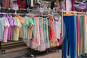 Colorful Indian costumes selling in front of the boutique shop in Brickfields Little India