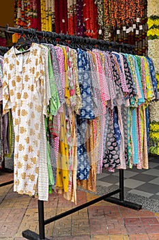 Colorful Indian costumes selling in front of the boutique shop in Brickfields Little India