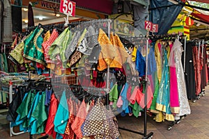 Colorful Indian costumes selling in front of the boutique shop in Brickfields Little India