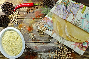 Colorful Indian food - chickpea, papadum and spices on textured