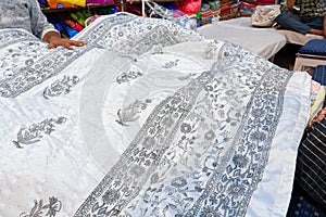 Colorful Indian sarees are displayed for sale at market place, Jaisalmer, India