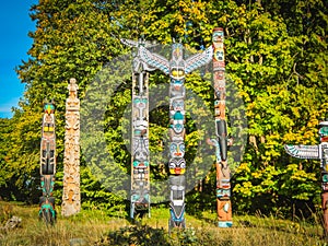 Colorful indian totems in stanley park vancouver canada photo