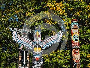 Colorful totems in stanley park vancouver canada photo