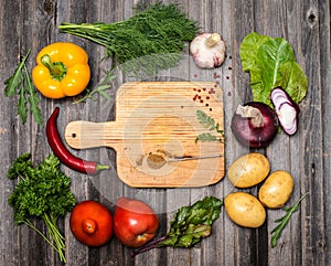 Colorful ingredients for vegetarian cooking on rustic weathered