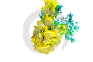 Colorful ink isolated on white background. yellow blue drop swirling under water. Cloud of ink in water.