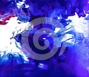 Colorful ink swirling in water