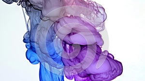 Colorful ink swirls in water photo