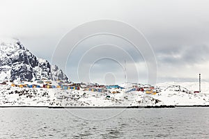 Colorful Inuit houses of Sisimiut city, view from the fjord, Greenland