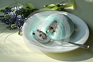 Colorful japanese daifuku mochi sweets with flower decoration