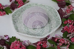 Colorful japanese daifuku mochi sweets with flower decoration