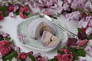 Colorful japanese daifuku mochi sweets with flower decoration